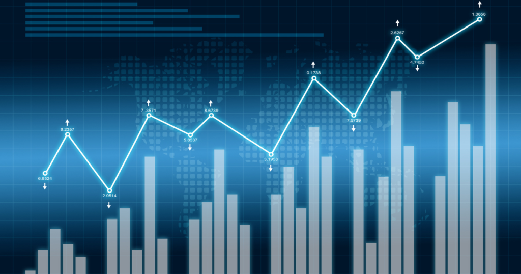 Digital financial graph with upward trend line and bar chart overlay on a blue grid background.